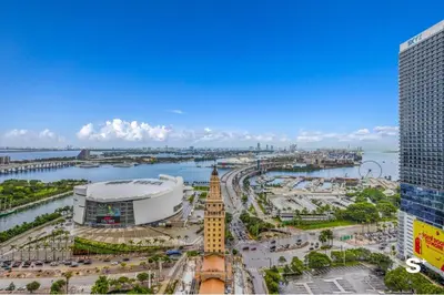 a view of a city with a building and a river at Luxury Downtown 2-BD Condo with beautiful city views in Miami