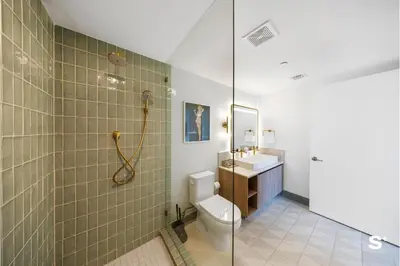 a bathroom with a shower and a toilet and a sink at Luxury Downtown 2-BD Condo with beautiful city views in Miami