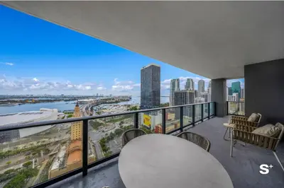 a balcony with a view of a city skyline at Upscale 3-BD Condo in Downtown Miami in Miami