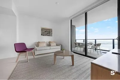 a living room with a couch and a table at Upscale 3-BD Condo in Downtown Miami in Miami