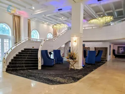 a staircase in a building with blue chairs at Alexander 1419 in Miami Beach