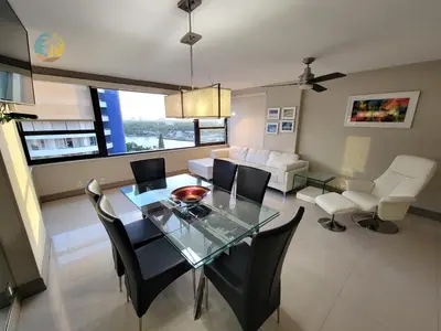 a dining room and living room with a glass table and chairs at Alexander 1419 in Miami Beach