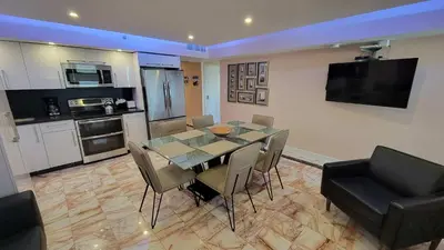 a kitchen and dining room with a table and chairs at Alexander 1420 in Miami Beach