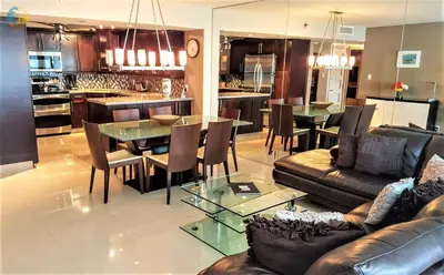 a living room with a couch and a table and chairs at Alexander 1421 in Miami Beach