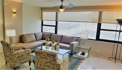 a living room with a couch and chairs and a table at Alexander 1618 in Miami Beach