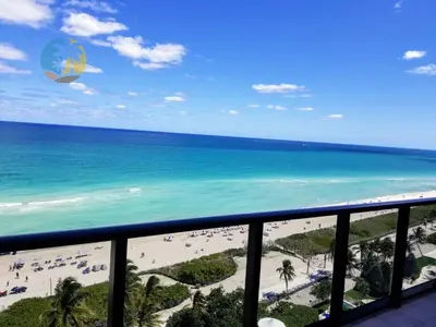 a view of the beach from the balcony of a resort at Alexander 1701 in Miami Beach