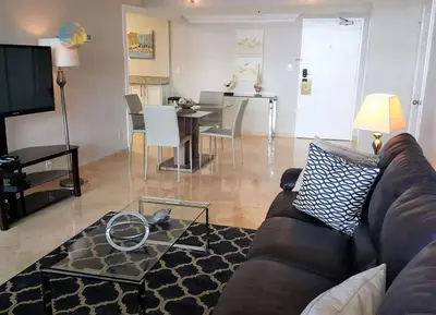a living room with a couch and a table at Alexander 510 in Miami Beach