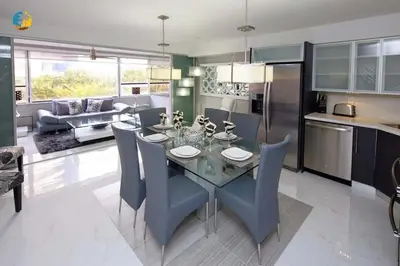 a kitchen and living room with a table and chairs at Alexander 519 in Miami Beach