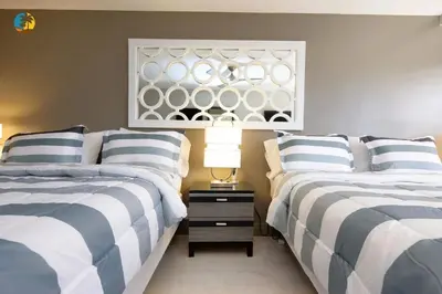 a bedroom with two beds and a window at Alexander 519 in Miami Beach
