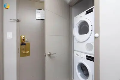 a washing machine and a washer and dryer in a room at Alexander 519 in Miami Beach