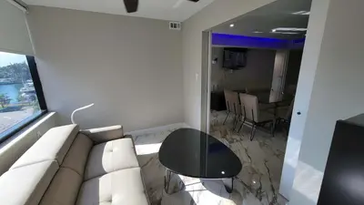 a living room with a white couch and a table at Alexander 521 in Miami Beach
