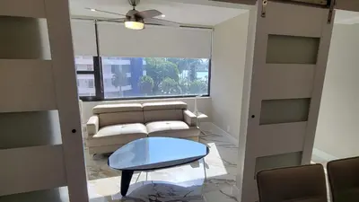 a living room with a couch and a table at Alexander 521 in Miami Beach