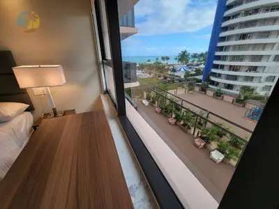 a hotel room with a balcony with a view of the ocean at Alexander 611 in Miami Beach