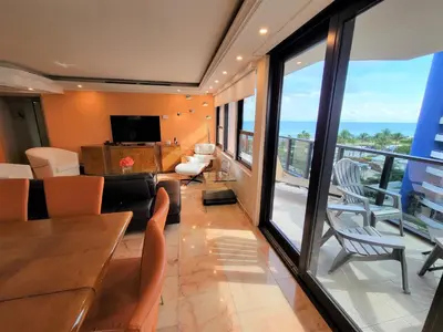 a living room with a view of a balcony at Alexander 807 in Miami Beach
