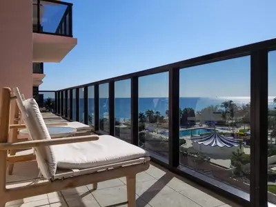 a balcony with chairs and a view of the ocean at Alexander 807 in Miami Beach