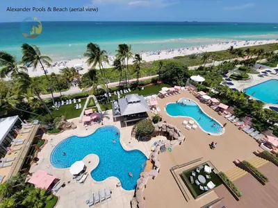 an aerial view of a beach resort with two pools at Alexander 819 in Miami Beach