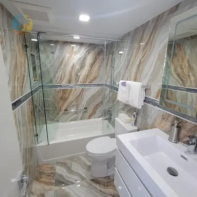 a bathroom with a toilet and a shower and a sink at Alexander 81921 in Miami Beach