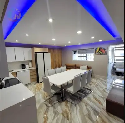a dining room with a white table and chairs at Alexander 821 in Miami Beach