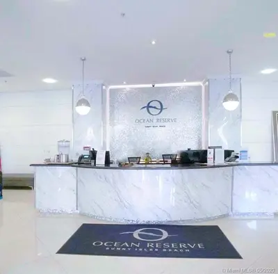 a white counter with a sign in a room at Apartment 2BR 2BTH - Free Parking in Sunny Isles Beach