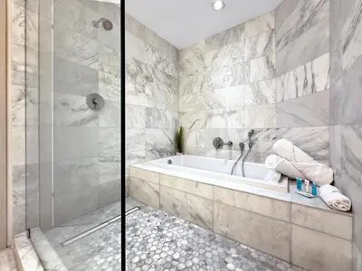 a bathroom with a tub and a shower at Tiffany Tides - Resort-Style Beach Townhome - Gym, Rooftop Pool and Sauna in Fort Lauderdale