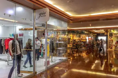 a store with people walking around in a shopping mall at The Grand Wonder Biscayne in Miami