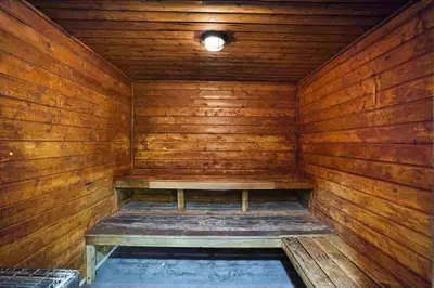 an empty wooden sauna with a bench in it at The Grand Wonder Biscayne in Miami