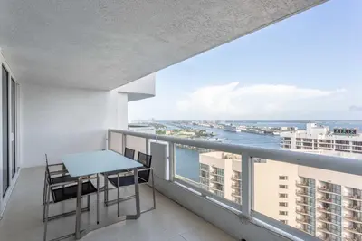 a balcony with a table and chairs and a view of the ocean at The Grand Wonder Biscayne in Miami