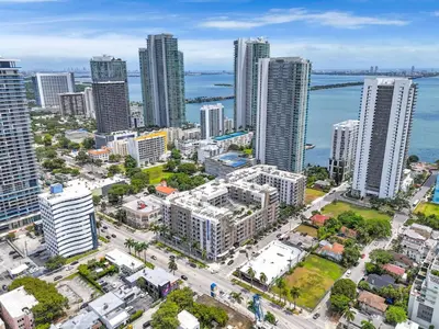 an aerial view of a city with tall buildings at Stylish 1BR Unit With Free Parking Near Wynwood in Miami