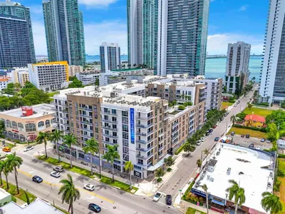 an aerial view of a city with tall buildings at Stylish 1BR Unit With Free Parking Near Wynwood in Miami