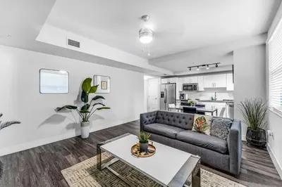 a living room with a couch and a table at Stylish 1BR Unit With Free Parking Near Wynwood in Miami