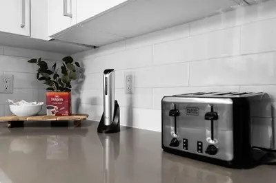 a toaster oven sitting on a counter in a kitchen at Sunny 1BR Unit With Free Parking Prime Location in Miami