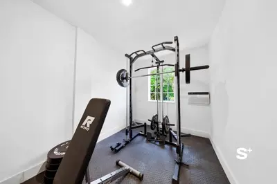 a room with a gym with a treadmill at Chic Miami Studio - Gym, BBQ, Free Parking in Miami
