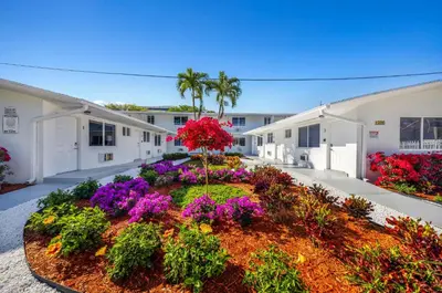 a garden in the middle of a building with flowers at Stylish Studio - Parking & Gym Near Aventura in Miami