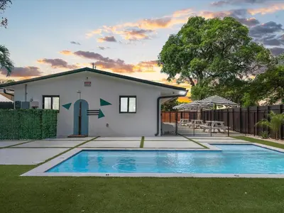 a house with a swimming pool in the yard at Hidden Gem Studio Near Wynwood & Beaches in Miami