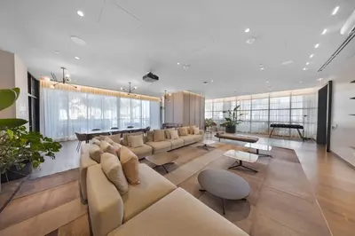 a large living room with a couch and a piano at Skyline 1-BD Condo - City & Ocean View in Miami