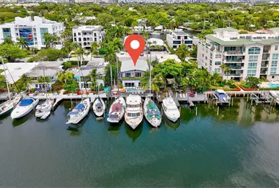 an aerial view of boats docked in a marina at 320-1 Las Olas Boulevard in Fort Lauderdale