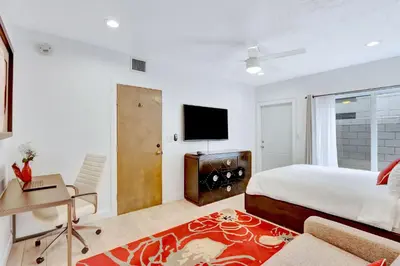 a bedroom with a bed and a flat screen tv at 320-1 Las Olas Boulevard in Fort Lauderdale