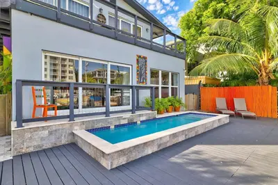 a house with a swimming pool in the backyard at Orange Dream in the Sky in Fort Lauderdale