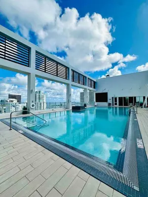 a large swimming pool on the roof of a building at Art-filled Loft 180 Views, Rooftop Pool, Parking in Miami