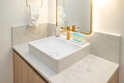 a bathroom with a white sink and a mirror at Splendid 1 Bed - Amazing views in Miami
