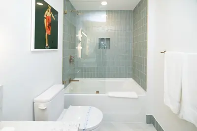 a bathroom with a tub and a toilet and a shower at Splendid 1 Bed - Amazing views in Miami