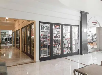 a store with many glass windows in a mall at Departamento sobre la Playa con vista a la Collins Ave in Sunny Isles Beach