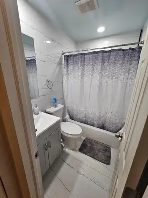 a small bathroom with a toilet and a sink at Hollywood Happiness in Hollywood