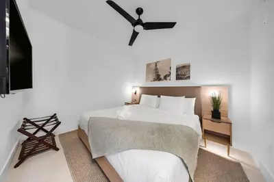 a bedroom with a bed and a ceiling fan at Upscale 1-BD Condo in DTW Miami - City Views in Miami