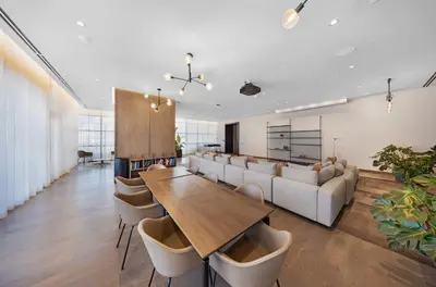 a living room with a couch and a table and chairs at Luxury 1-BD with Breathtaking Downtown Views in Miami
