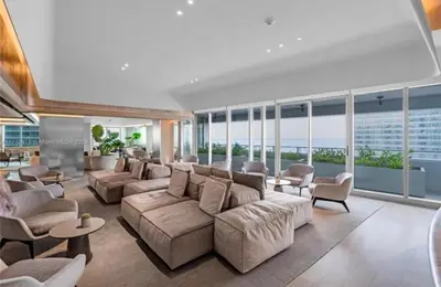 a large living room with a large couch and chairs at Brickell-AKA Free Parking by Palermo Home Miami in Miami