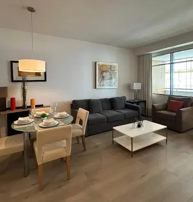 a living room with a couch and a table at Brickell-AKA Free Parking by Palermo Home Miami in Miami