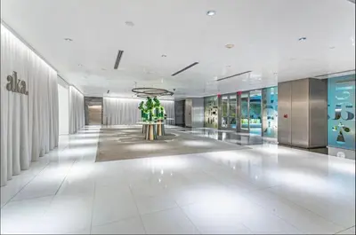 a lobby of a building with a statue in the middle at Brickell AKA 32th Free Parking by Palermo Home Miami in Miami
