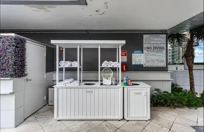a white kitchen with a counter in a building at Brickell AKA 32th Free Parking by Palermo Home Miami in Miami