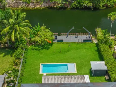 an aerial view of a backyard with a swimming pool at Luxury Miami Waterfront Retreat with Private Dock in Golden Glades